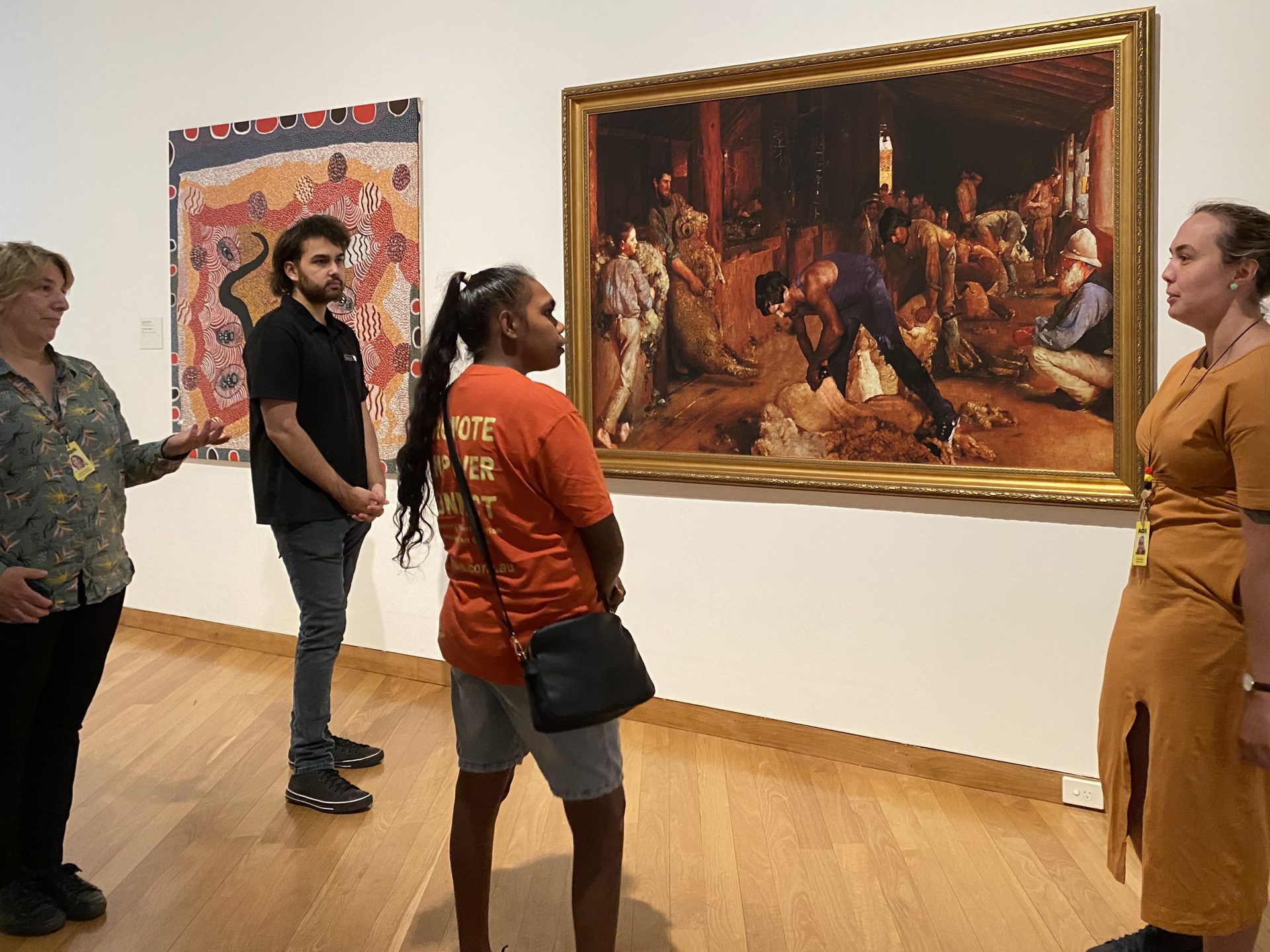 AGWA staff Natalie Hewlett and Zali Morgan talk to Dylan Kerley and Shontae Charles during their visit to Perth, 2022. Photographer: Glenda Dixon. 