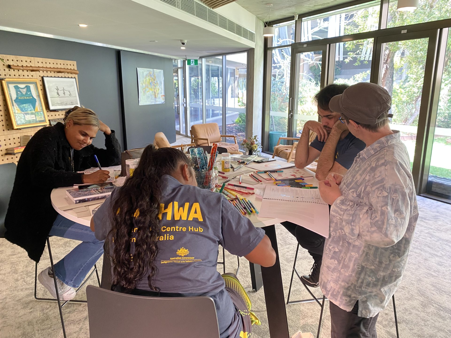 TAFE lecturer Dr Perdita Phillips talks through the design-process with Our Future participants Marrika Gilla, Shontae Charles and Dylan Kerley at Dandjoo Darbalung, 2022. Photographer: Glenda Dixon.