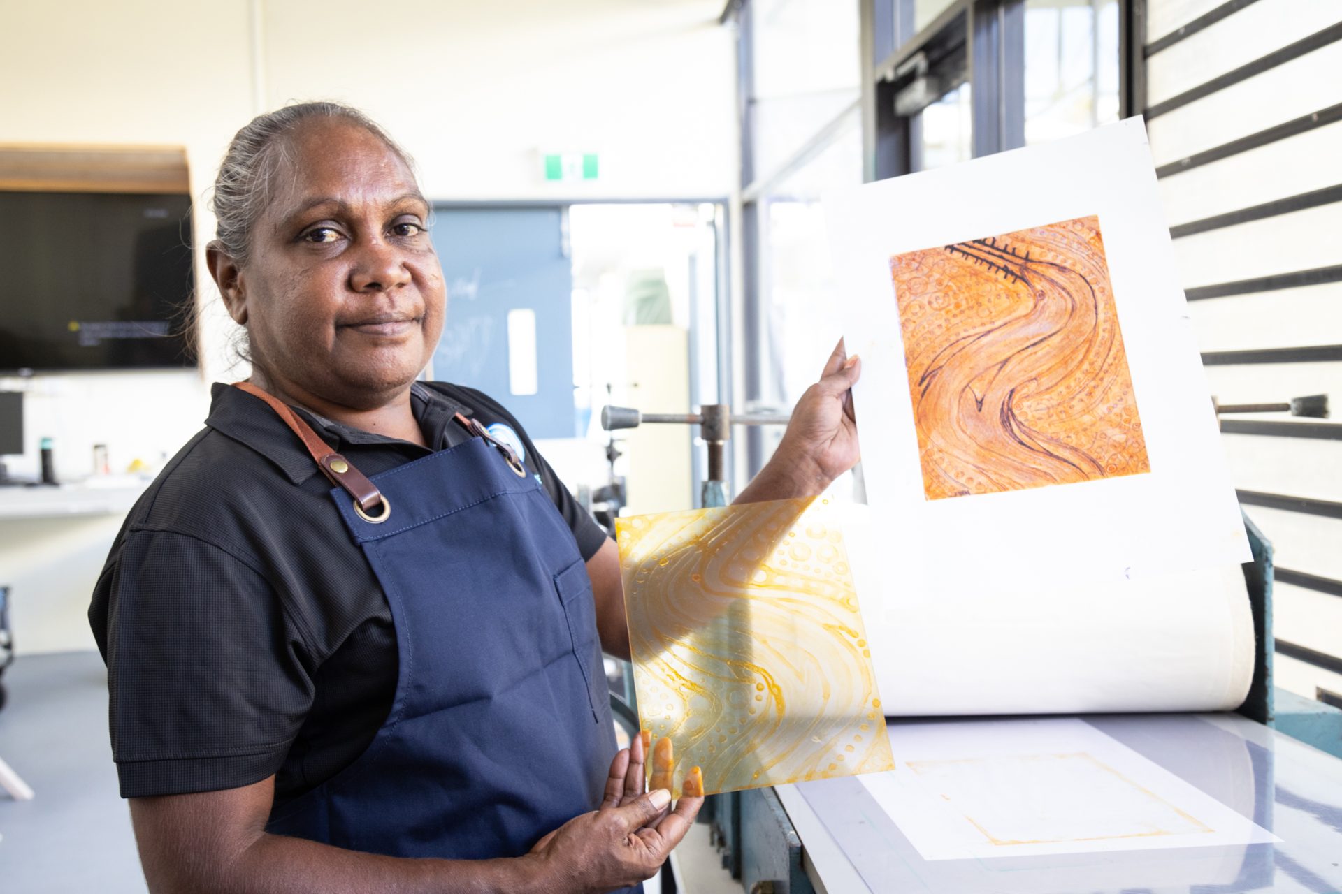 Monica Henry with her print at North Metropolitan TAFE studio, March 2024. Photograph by Balthazaar Media. 