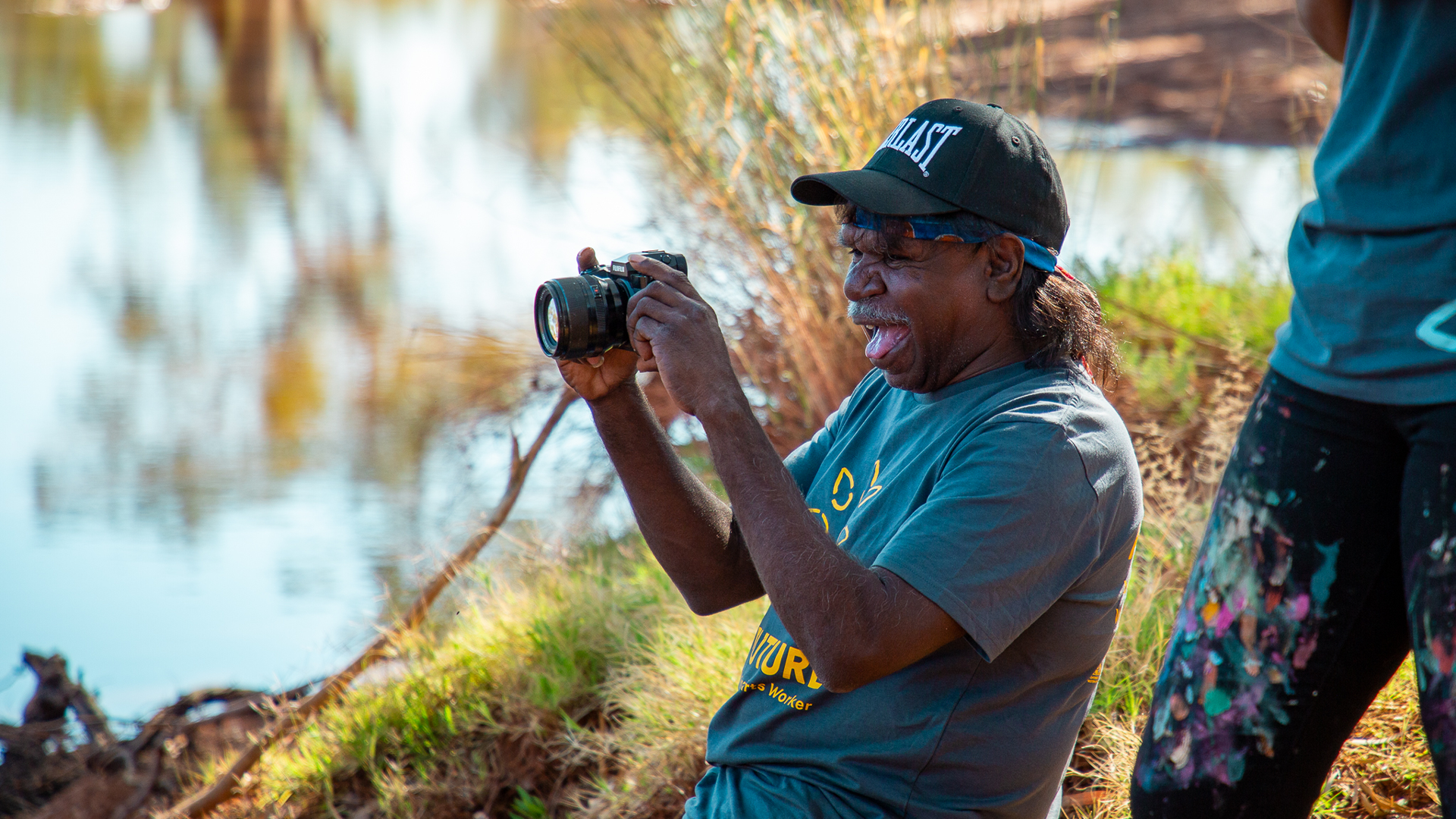 Henry Farmer tests his photography skills, Our Future: Aboriginal Arts Worker Training Program at Sandy Creek, Nyiyaparli Country (Newman). Photograph by Jessica Russell.