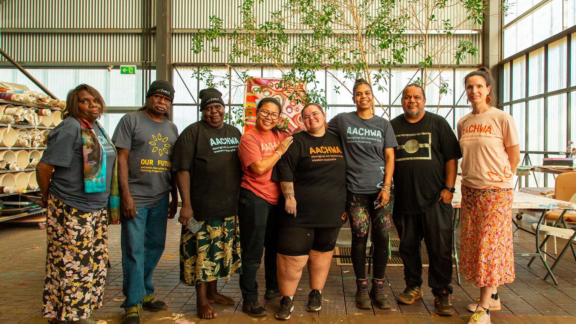 Sylvia Wilson, Henry Farmer, Julieanne Farmer, Jacky Cheng (Facilitator), Rekeshia Goodwin, Ruby Djikarra Alderton, Michael Torres (Photographer/Facilitator) and Glenda Dixon (AACHWA Program Manager), Our Future: Aboriginal Arts Worker Training Program at Martumili Artists, Nyiyaparli Country (Newman). Photograph by Jessica Russell.