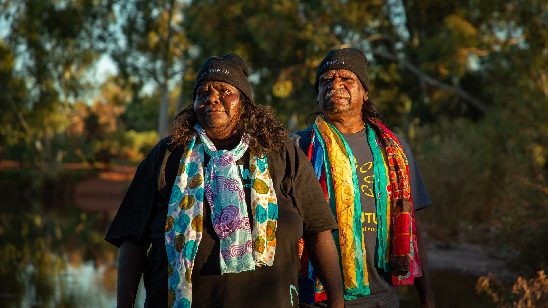 Julieanne Farmer (left) and Henry Farmer (left) modelling their silk scarves, Our Future: Aboriginal Arts Worker Training Program Nyiyaparli Country (Newman). Photograph by Jessica Russell 