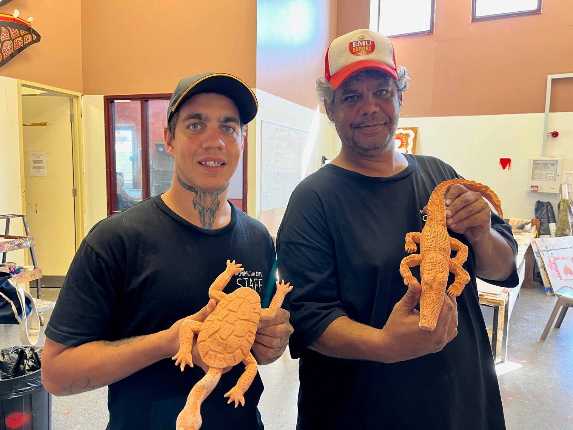 Two arts workers at the Mowanjum Arts Centre, showing off their new sculptural pieces, during a workshop facilitated by Tanya Lee and Robyn Lees, Our Country Moves Program, (Derby), 2024. Photo by AACHWA. 